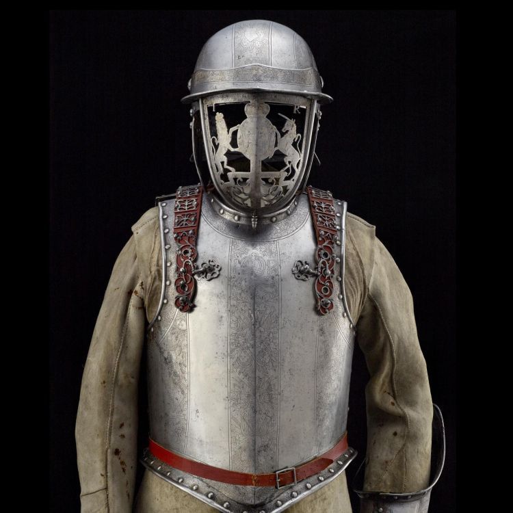 Steel helmet and face guard steel breastplate over a buff leather coat