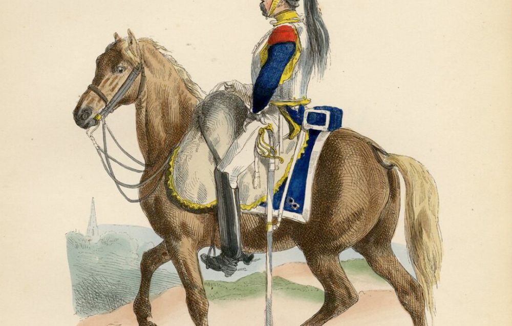 A cuirassier, French cavalryman, poses with a shining breastplate, dark flume in his helmet, and red and blue jacket.