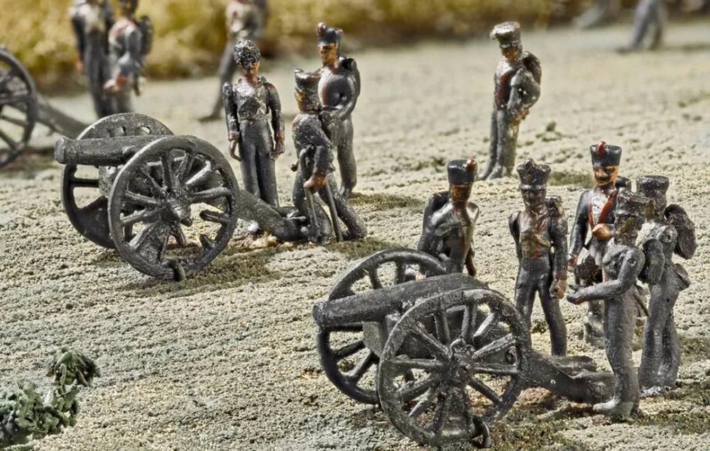 A battery of French cannons open fire on the enemy