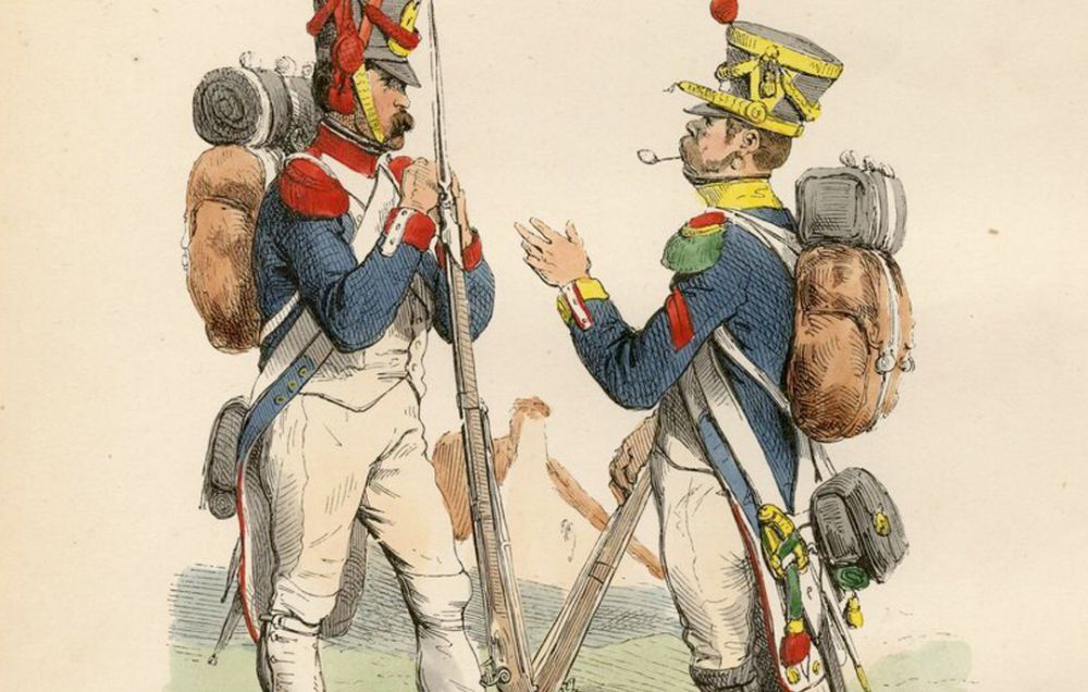 Two Napoleonic soldiers in blue jackets and white breeches, one with a red feather in this cap, the other with a yellow feather