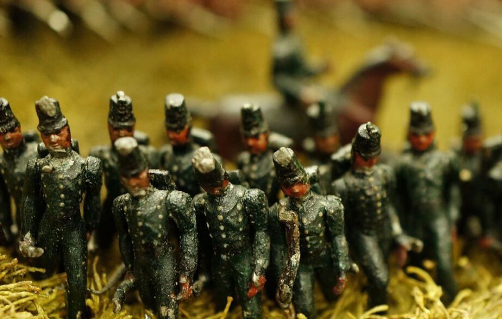 A line of soldiers reform and await attack