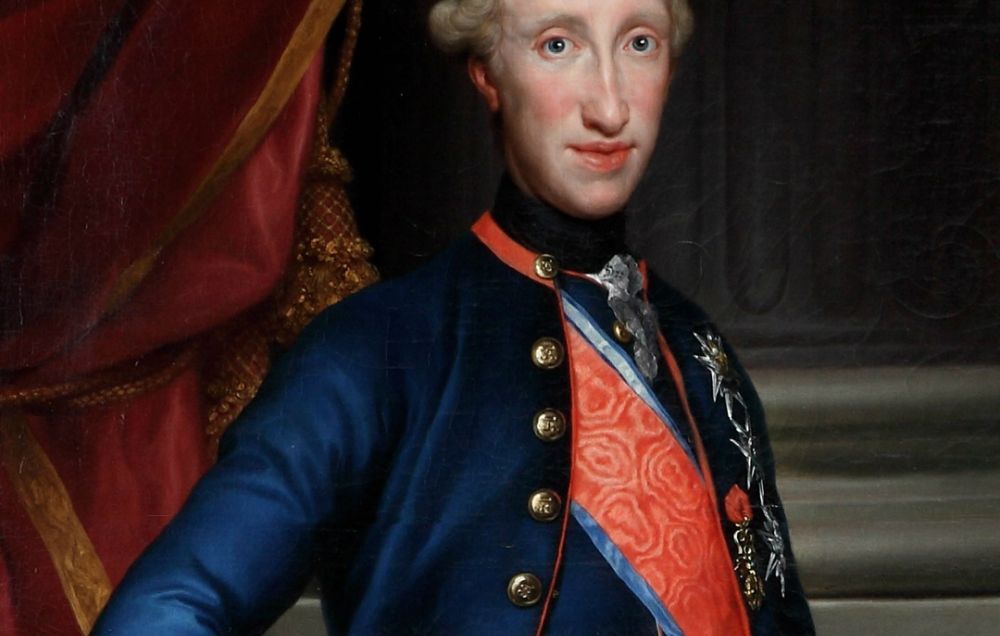 A portrait of Ferdinand I of the Two Sicilies dressed in powdered wig, dark blue overcoat and red sash