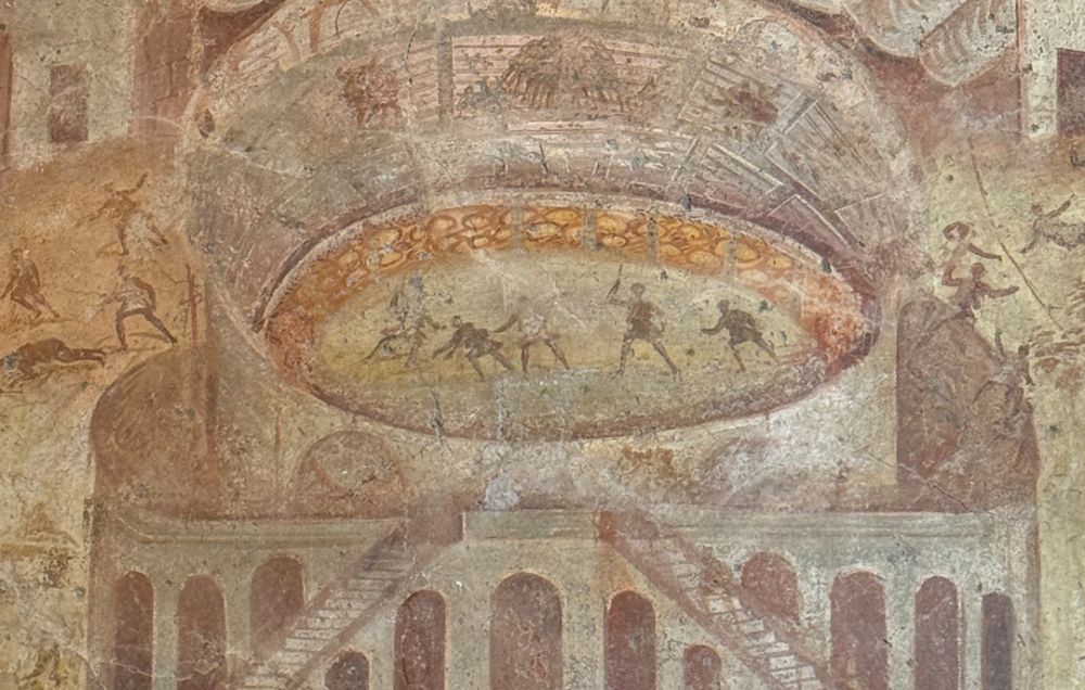 A Roman fresco of the Pompeian riot of 59 CE, with the amphitheatre in the centre