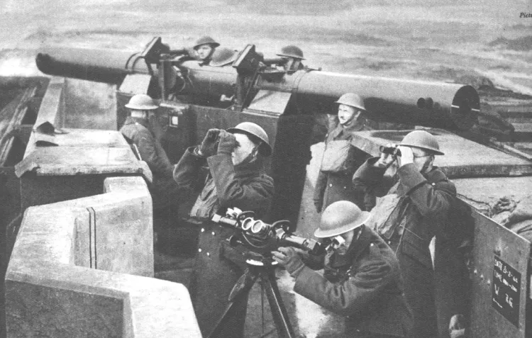 A black and white photo of a collection of British soldiers during the Second World War monitoring the skies for signs of German aircraft.