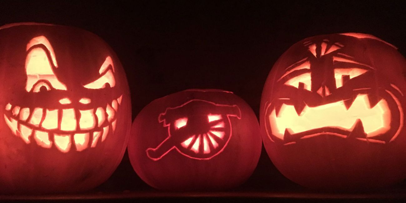 3 different sized pumpkins with face features carved into them for Halloween