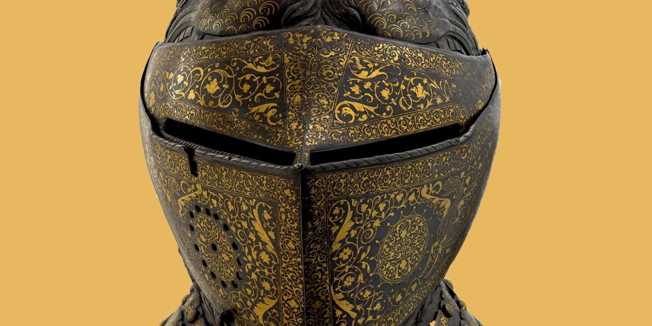 decorated knights helmet on a golden background