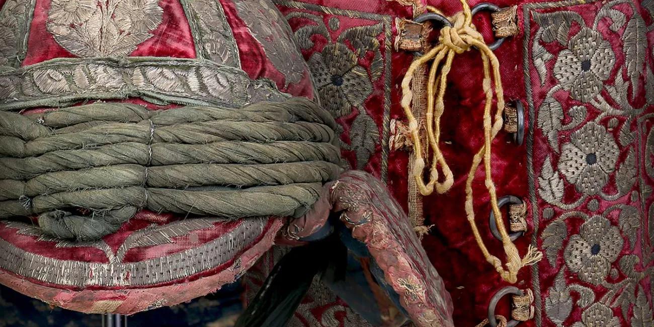 highly decorated red and silver Indian helmet and armour from our collection