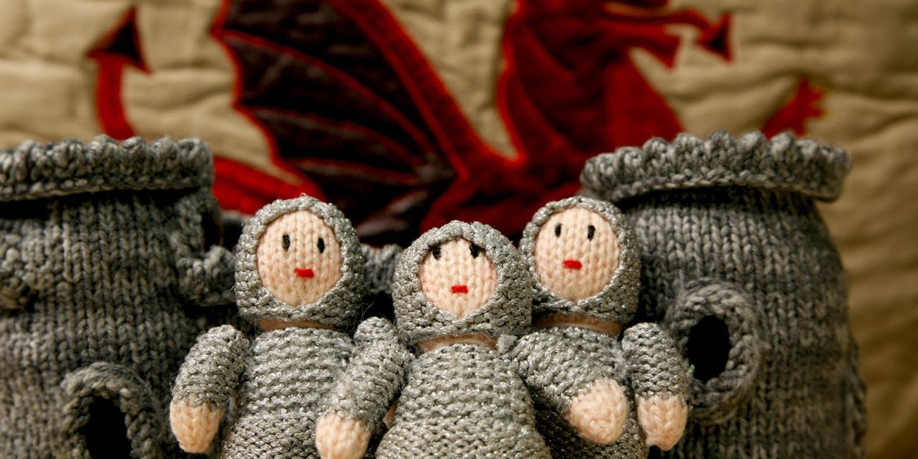three toy knights knitted from wool