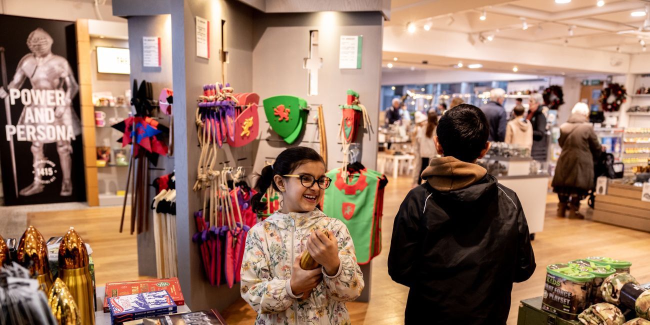 2 children looking at all of the interesting objects on display in the Leeds shop