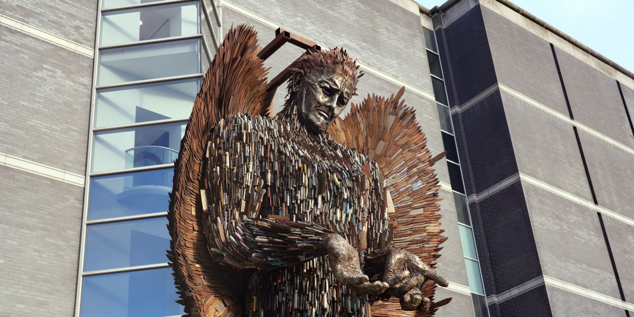 A large sculpture in the form of angel made from rusting knives