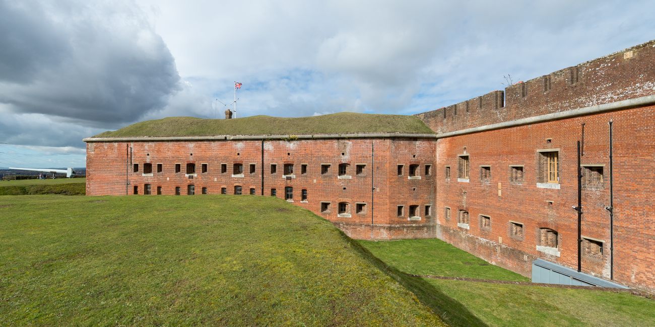 Walls of Victorian fort and grassed moat