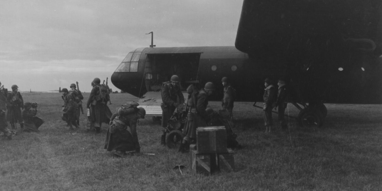 Soldiers disembarking a transport plane.