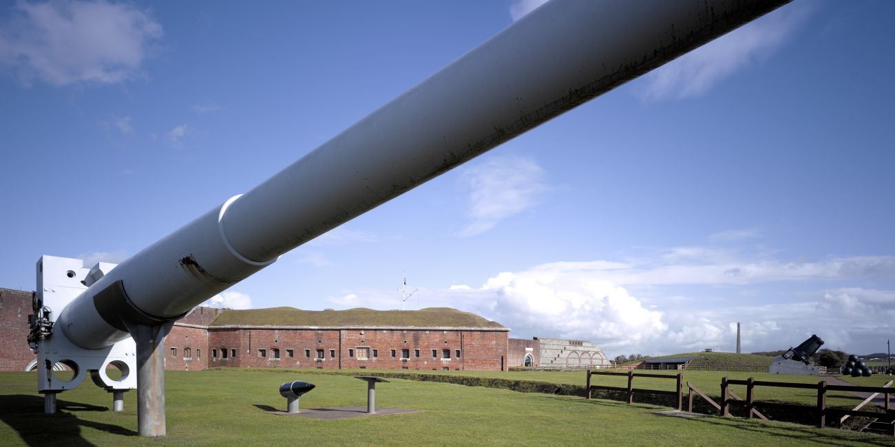 Front view of Fort Nelson and battleship gun.