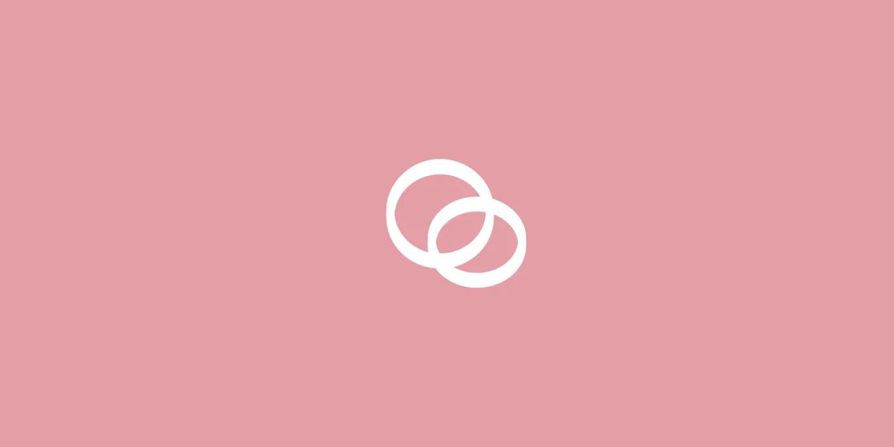 2 rings linked together on a pink background