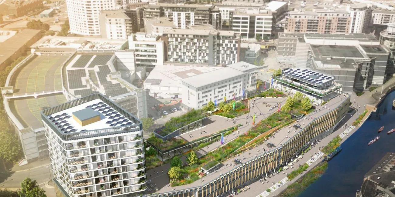 Computer generated image of a new building seen from above adjacent to the waterfront on Leeds Dock