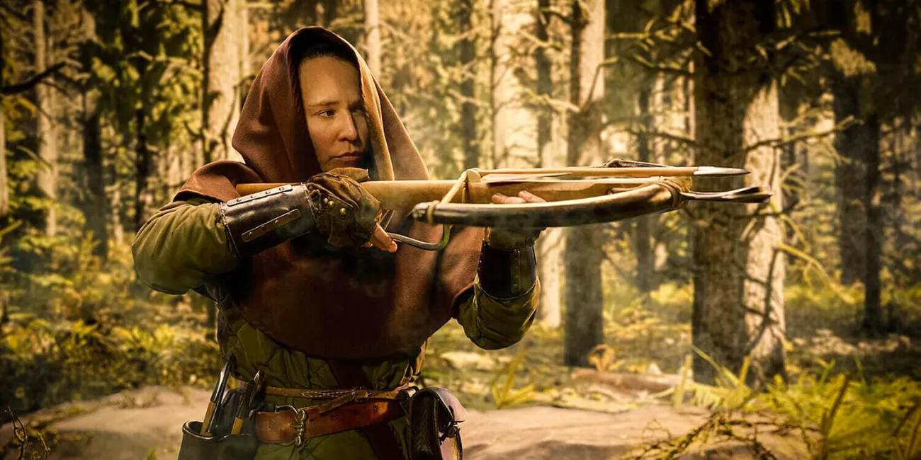 A hooded medieval hunter in the forest taking aim with their crossbow