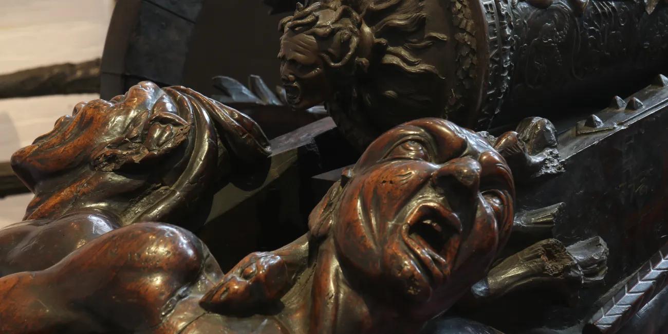 Wooden carving of faces