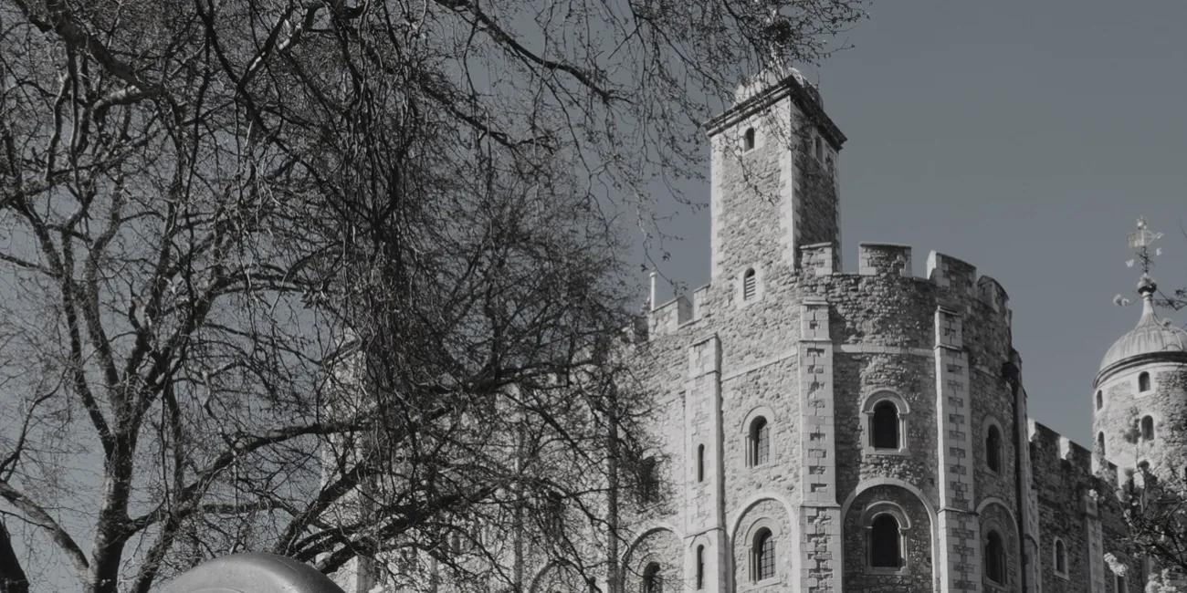 A desaturated image of the parapets of the White Tower at the Tower of London