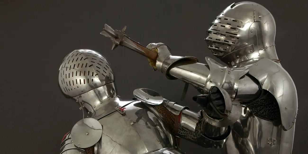 Two knights battling in armour with pollaxe