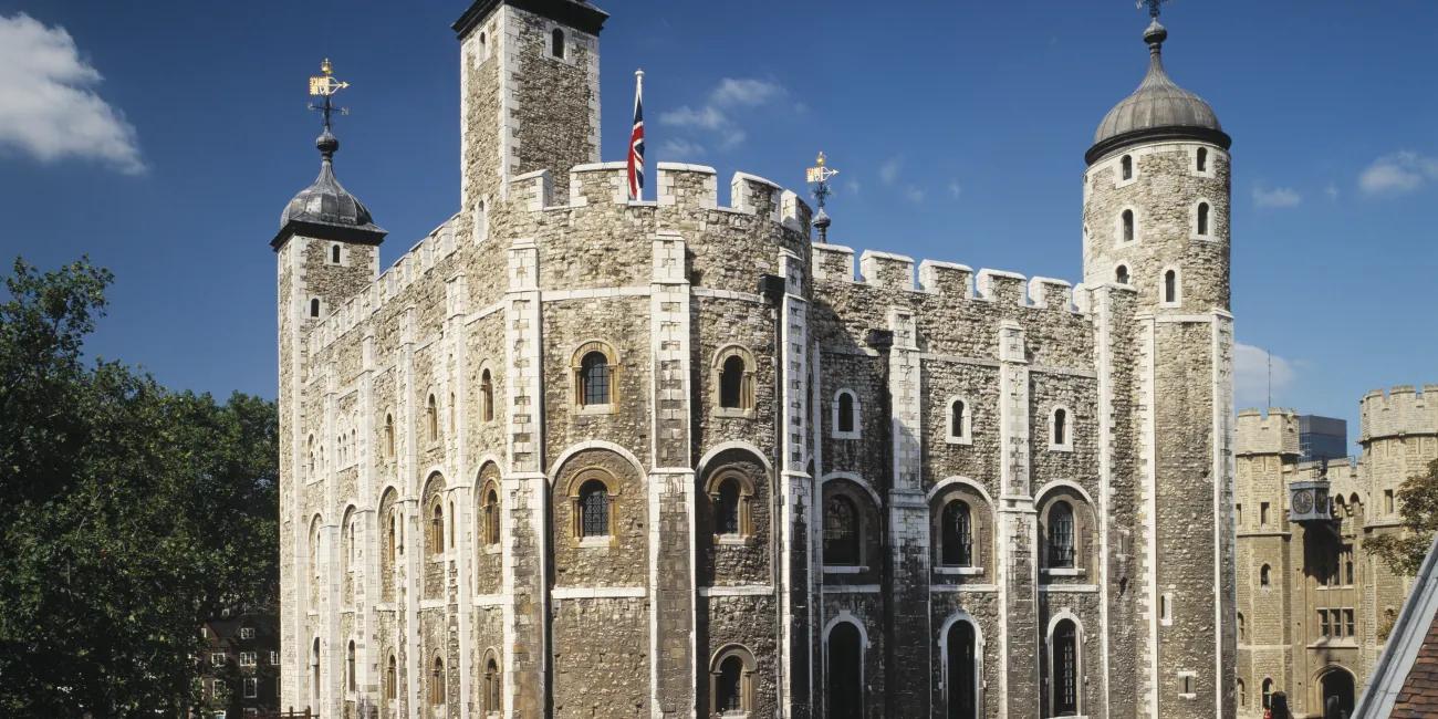 The White Tower, Tower of London, England, against a bright blue sky in Summer.