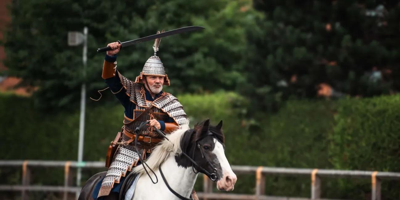 Horseman in Mongolian armour wielding a sword