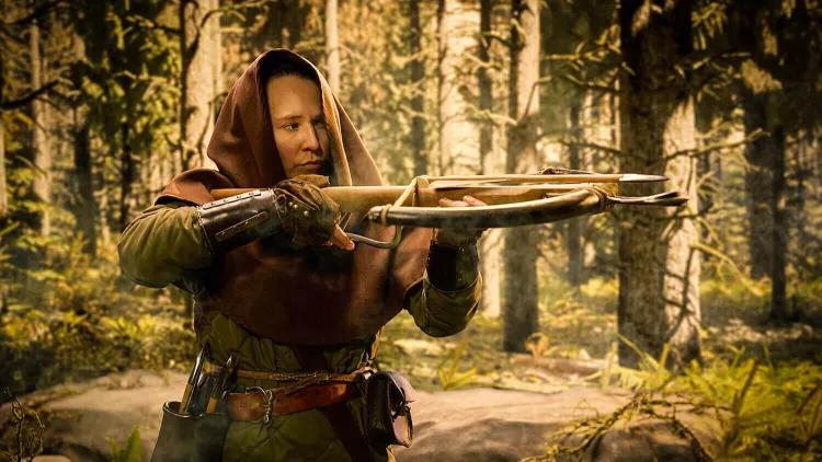 A hooded medieval hunter in the forest taking aim with their crossbow