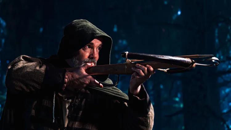 Man with crossbow