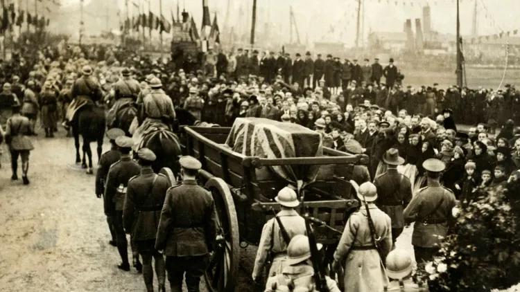 Photograph of coffin draped in Union Jack flag on a carriage