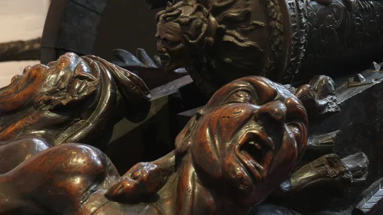 Wooden carving of faces