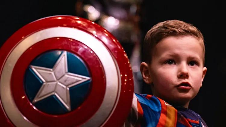 Young boy dressed as superhero