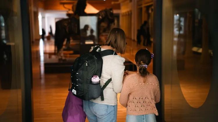 An adult and child entering the Asian and African Gallery.