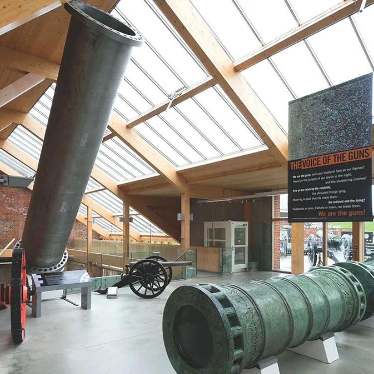 2 large gun barrels on display inside of Fort Nelson