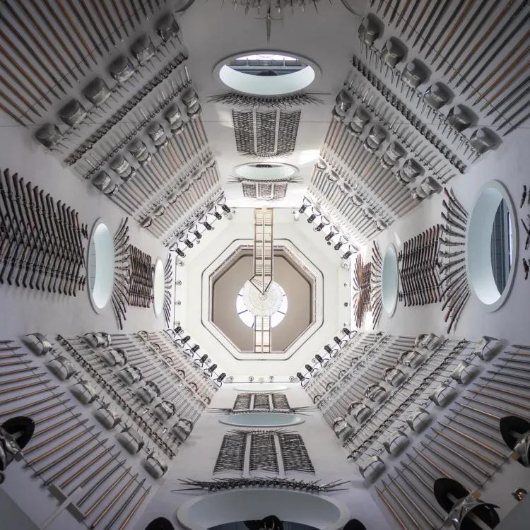 looking up at the Hall of Steel interior with every wall covered in magnificent arms and armour displays