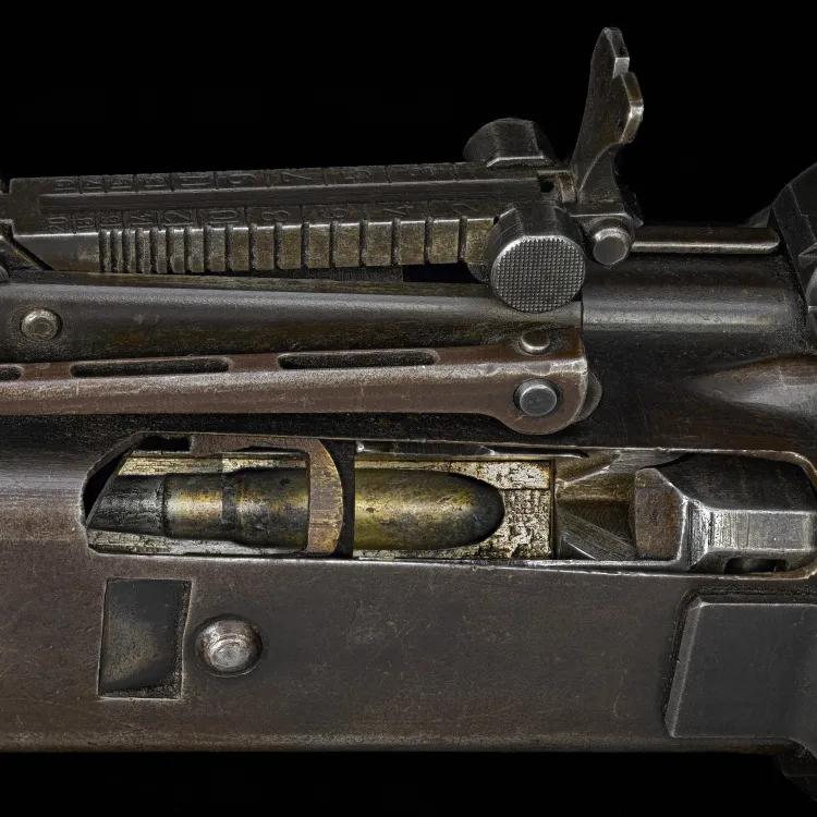 A brown, rusted gun