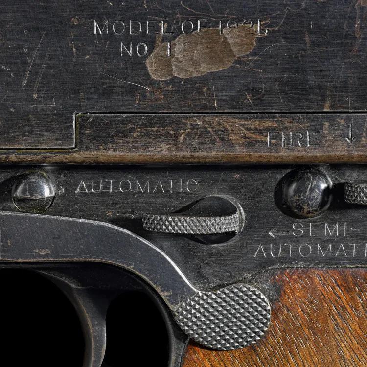 Close up of a gun with a scratch over the serial number
