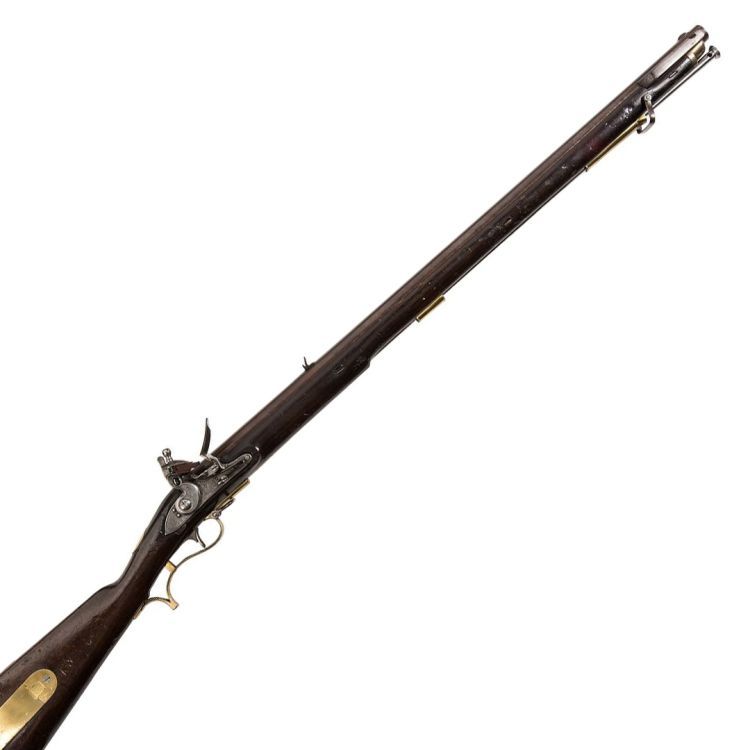 A flintlock rifle in dark wood and steel, complete with brass trim