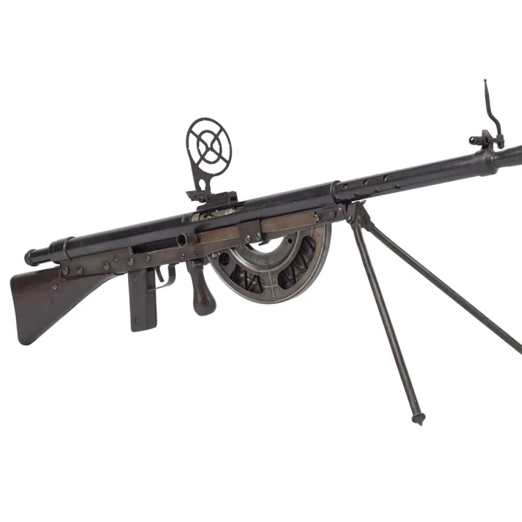 A thin barrelled machine rifle with wide optical sights and curved magazine attached on the underside