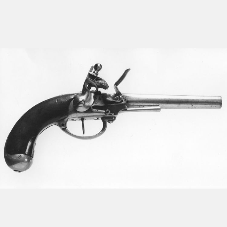 A flintlock pistol with heavy brass trigger guard and thin iron ramrod