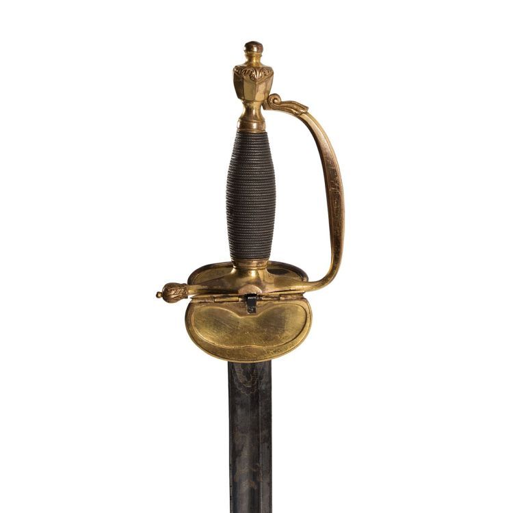 A thin tapering blade attached to brass gilt hilt, a broad, flat cross guard and single bar knuckle guard