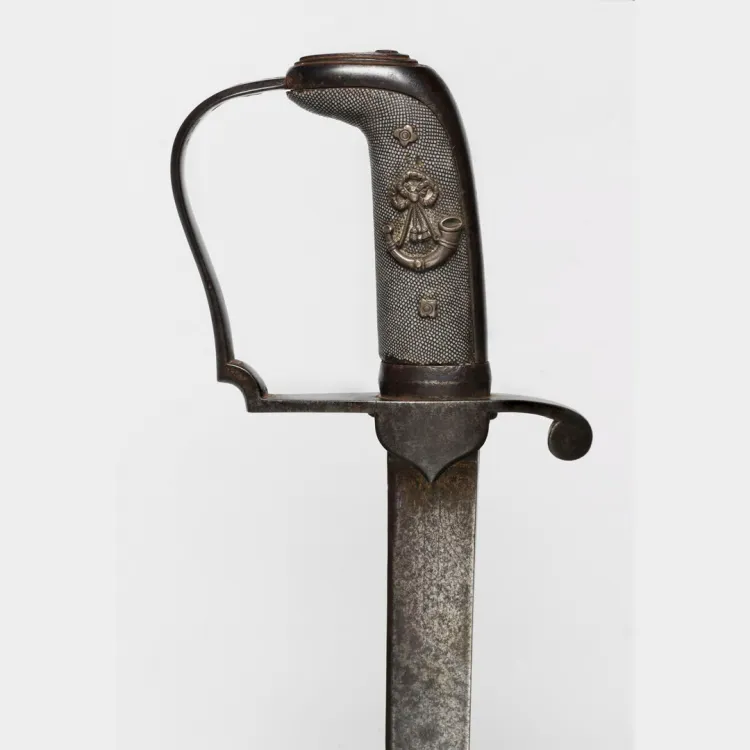 An infantry officer's sword with crowned light infantry bugle, wreathed in royal arms engraved on the hilt
