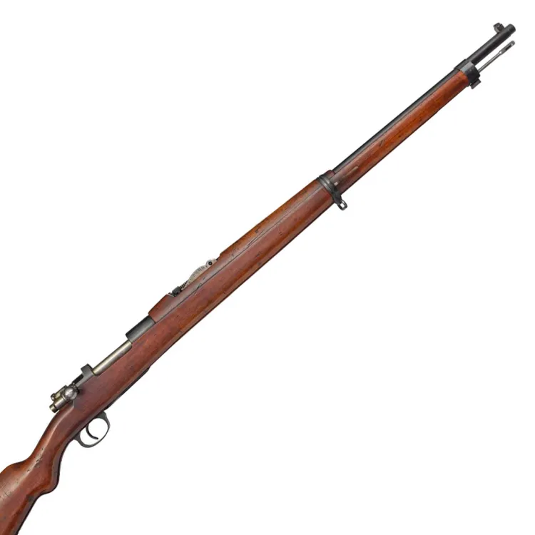 A long barrelled rifle finished in wood with metallic fittings