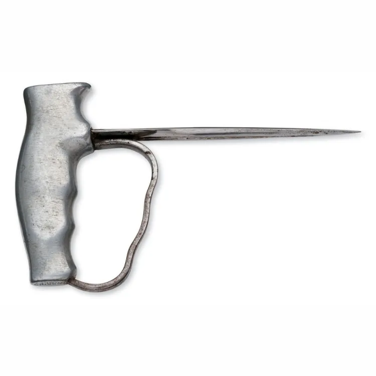 A thin spike attached to a metal hand grip with a small strip protecting the knuckles
