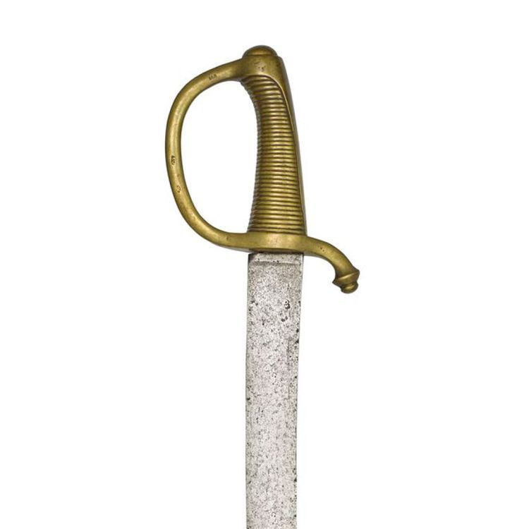 Cast brass sword hilt with ovoid pommel, 36 lateral ribs, knuckle guard and single edged curved blade.