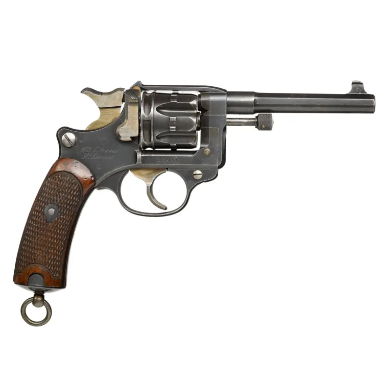 A steel and brass/bronze six shot revolver with wooden grip
