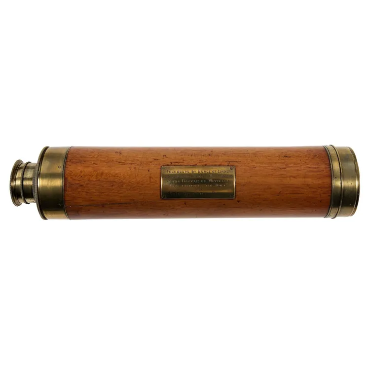 A wooden cylinder with brass trim on either end and a brass inscription indicating ownership by Wellington