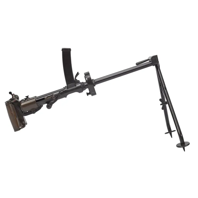 A small sub-machine gun with two barrels supported by a bipod on the barrel end