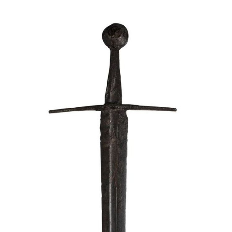 Short two edged blade with small wheel pommel and down-curved cross guard.
