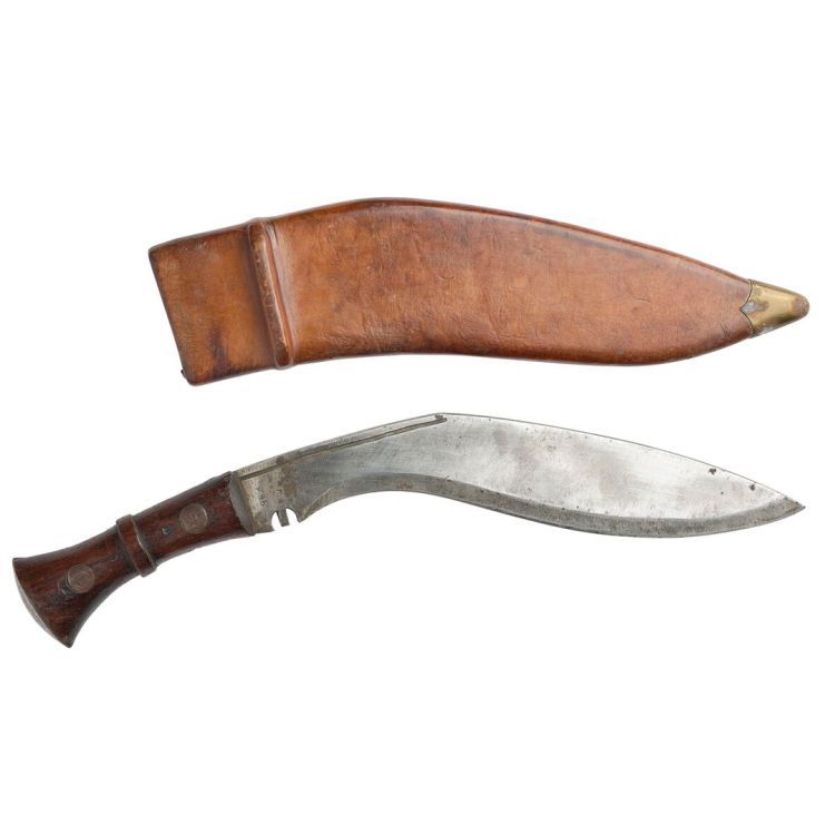 A kukri steel knife with curved blade and leather sheath