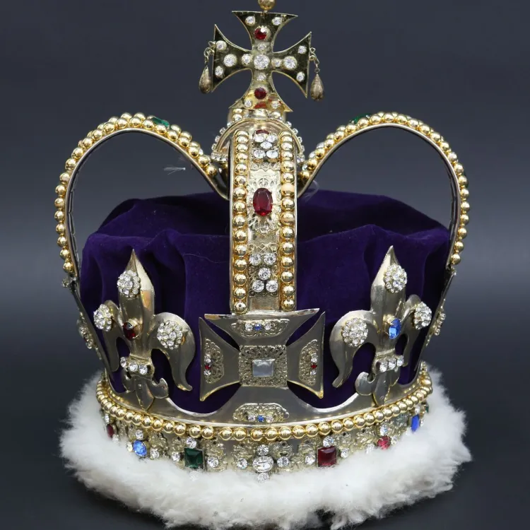 A gold crown trimmed with white fur and an assortment of jewels