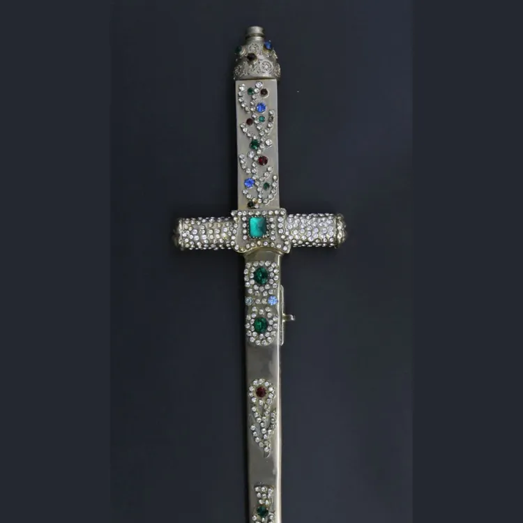 A silvered sword hilt encrusted with inlaid jewels and diamonds